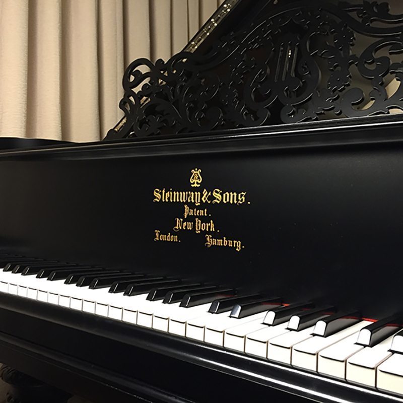 restored antique grand piano
